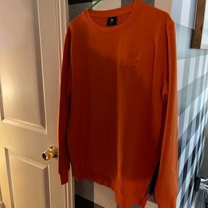 YoungLA brand, orange sweater, side zipper. Never worn